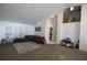 Bright living room with carpet floors, neutral colors, and shuttered windows at 10402 Ashley Oaks Drive, Riverview, FL 33578