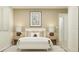 Charming bedroom with a bed, lamps, and framed art at 11721 Brae Way, Dade City, FL 33525