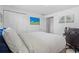 Bedroom with a view of palm trees, a ceiling fan, and white walls at 12359 82Nd N Ave, Seminole, FL 33772