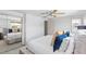 Bright bedroom featuring a ceiling fan, closet, and neutral tones throughout at 12359 82Nd N Ave, Seminole, FL 33772