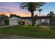 Charming single-story home with lush lawn, mature landscaping, and attached garage at 12359 82Nd N Ave, Seminole, FL 33772