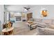 Bright living room with a cozy fireplace, hardwood floors, and an open concept design at 12359 82Nd N Ave, Seminole, FL 33772