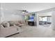 Spacious living room with patio access, light-filled space with neutral decor and ample seating at 12359 82Nd N Ave, Seminole, FL 33772