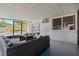 Patio showcasing an outdoor seating area and access to a pool through sliding glass doors at 12359 82Nd N Ave, Seminole, FL 33772