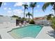 Backyard pool with lounge chairs and landscaping, perfect for relaxing and entertaining at 12359 82Nd N Ave, Seminole, FL 33772