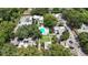 Overhead view of apartments and community pool with mature trees and landscaping at 125 Picardy Villa Cir # 100, Brandon, FL 33510