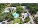 Inviting apartments feature a sparkling blue pool surrounded by lush green lawns and mature trees at 125 Picardy Villa Cir # 100, Brandon, FL 33510