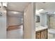 Bathroom featuring tiled floors, modern vanity with updated fixtures, and tile shower at 125 Picardy Villa Cir # 100, Brandon, FL 33510