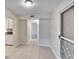 Hallway with tiled floors leads to the bedrooms, kitchen and front door at 125 Picardy Villa Cir # 100, Brandon, FL 33510