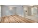 Open floor plan showcases light wood flooring and recessed lighting in the living area at 125 Picardy Villa Cir # 100, Brandon, FL 33510