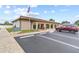 Community center exterior with parking lot, well maintained landscape and visible signage at 12501 Ulmerton Rd # 110, Largo, FL 33774