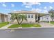 Inviting manufactured home with neat landscaping, a convenient covered parking area, and pleasant curb appeal at 12501 Ulmerton Rd # 110, Largo, FL 33774