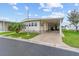 Charming manufactured home with a well-manicured lawn and a covered parking area, perfect for a relaxed lifestyle at 12501 Ulmerton Rd # 110, Largo, FL 33774
