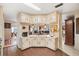 Efficient kitchen featuring ample counter space, a coffee bar, and seamless flow to the living area at 12501 Ulmerton Rd # 110, Largo, FL 33774