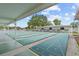 Outdoor shuffleboard courts under a covered area, perfect for community recreation and leisure at 12501 Ulmerton Rd # 110, Largo, FL 33774
