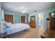 Another bedroom view showcasing closet doors and an en-suite bathroom at 13296 88Th N Ave, Seminole, FL 33776