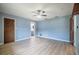 An empty bedroom featuring wood floors, ceiling fan, and two large closets at 13296 88Th N Ave, Seminole, FL 33776