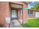 Inviting brick porch with 'Welcome' decor, plants, and views of the front yard at 13296 88Th N Ave, Seminole, FL 33776