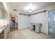 Kitchen area featuring tile floor, serving area, and easy access to dining and other rooms at 13296 88Th N Ave, Seminole, FL 33776