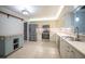 A kitchen with tile floors, recessed lighting, stainless steel appliances and ample cabinet space at 13296 88Th N Ave, Seminole, FL 33776
