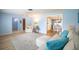 Bright living room with light blue walls, hardwood floors, and an adjacent dining area at 13296 88Th N Ave, Seminole, FL 33776
