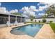 Beautiful pool with tile surround and screened in lanai in backyard at 13296 88Th N Ave, Seminole, FL 33776