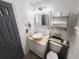 A clean bathroom featuring a modern sink, vanity, toilet, and towel rack at 1335 Waikiki Way, Tampa, FL 33619