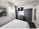 Cozy bedroom featuring a double bed, a dresser, and closet space at 1335 Waikiki Way, Tampa, FL 33619