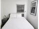 Bright bedroom with a comfortable queen bed, bedside table and tasteful wall art at 1335 Waikiki Way, Tampa, FL 33619