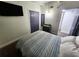 Cozy bedroom features a comfortable bed, closet, and neutral decor at 1335 Waikiki Way, Tampa, FL 33619