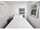 Bright bedroom featuring a cozy queen bed and a modern bedside table at 1335 Waikiki Way, Tampa, FL 33619