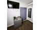 Bedroom featuring a dresser, closet, and mounted television at 1335 Waikiki Way, Tampa, FL 33619