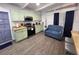 Kitchen featuring green cabinets, stainless appliances, eating area, and adjacent breakfast bar at 1335 Waikiki Way, Tampa, FL 33619