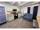 Kitchen featuring green cabinets, stainless appliances, eating area, and adjacent breakfast bar at 1335 Waikiki Way, Tampa, FL 33619