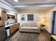 Bright living area with a kitchenette and comfortable sofa at 1335 Waikiki Way, Tampa, FL 33619