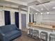Comfortable living room with breakfast bar, seating, and stylish pendant lights at 1335 Waikiki Way, Tampa, FL 33619