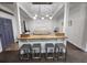 Open-concept living area with breakfast bar, seating, and modern lighting fixtures at 1335 Waikiki Way, Tampa, FL 33619