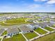 Aerial view of a new suburban community with manicured lawns and modern homes at 14532 Whitewater Way, Brooksville, FL 34604
