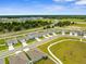 Overhead view of homes featuring well-kept lawns, driveways, and neat landscaping in a suburban setting at 14532 Whitewater Way, Brooksville, FL 34604