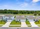 Scenic aerial view of a neighborhood with neatly arranged homes, green spaces, and community landscaping at 14532 Whitewater Way, Brooksville, FL 34604