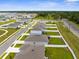 Panoramic aerial view of a suburban neighborhood showcasing modern homes, green spaces, and community planning at 14532 Whitewater Way, Brooksville, FL 34604