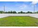 Lush backyard featuring a well-maintained lawn and a privacy fence for outdoor enjoyment at 14532 Whitewater Way, Brooksville, FL 34604