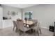 Dining area featuring tile floors, neutral colors, and a sliding glass door view to the yard at 14532 Whitewater Way, Brooksville, FL 34604