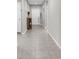Bright hallway with neutral colors and durable tile flooring at 14532 Whitewater Way, Brooksville, FL 34604