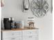Kitchen decor with a coffee maker and decorations on top of a wooden kitchen island at 14532 Whitewater Way, Brooksville, FL 34604