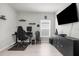 Office space featuring a sleek black gaming setup and natural light at 14532 Whitewater Way, Brooksville, FL 34604