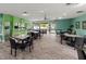 Well-lit dining area with multiple tables and chairs, perfect for social gatherings at 147 114Th Ne Ave # 147, St Petersburg, FL 33716
