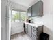 Well-lit kitchen with ample cabinet space and view to outdoor parking at 147 114Th Ne Ave # 147, St Petersburg, FL 33716