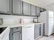 Modern kitchen featuring gray cabinets and bright countertops at 147 114Th Ne Ave # 147, St Petersburg, FL 33716