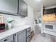 Kitchen view with appliances and easy transition to the main living area at 147 114Th Ne Ave # 147, St Petersburg, FL 33716